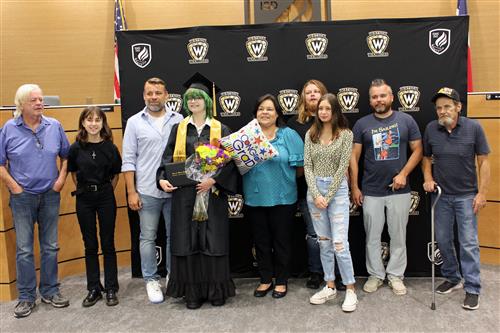 Graduate surrounded by family